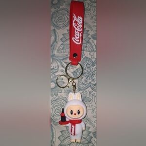Bundle of LABUBU'S Coca-Cola Keychains.